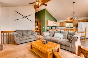 The living area has comfy sofas and chairs so that your entire group can relax and enjoy a movie or the beautiful views.