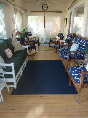 Enter the front porch from the brick walkway and begin your relaxation.