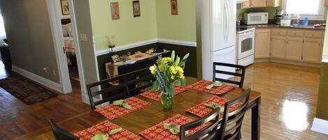 View of the dining room, kitchen and hall with a glimpse of the second bedroom