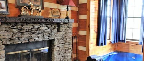 Stack stone fireplace with locally hand carved Black Walnut mantle.