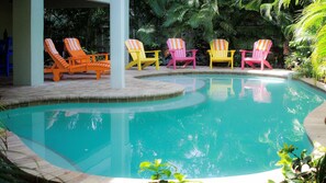 Private pool & covered lanai with bar, patio table, deck chairs, TV and foosball