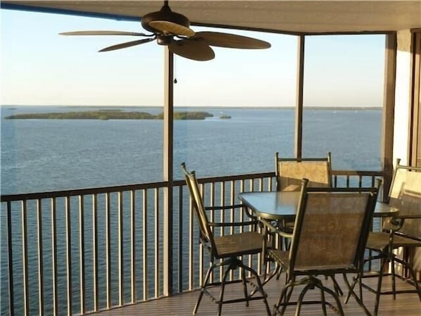 Enclosed terrace with dining table, sun lounger, ceiling fan.  Terrific views!
