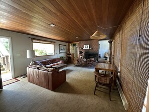 Common room with fireplace and dining table. Seats 8. 