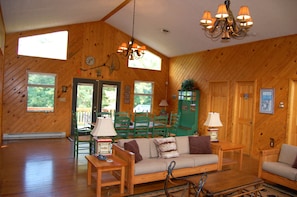 Double doors provide access to deck area and outdoor gas grill.
