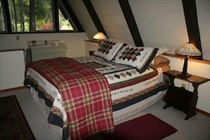 The bedroom and half bath in upstairs loft.