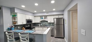 Fully stocked kitchen with all cooking utensils, pots & pans and appliances