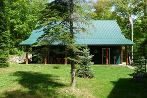 Porch Area with Plenty of Chairs, Picnic Table and Gas Grill