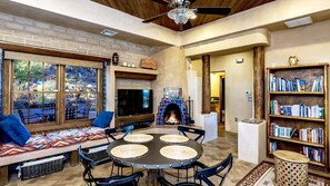 The glowing kiva fireplace adds warmth to this relaxing space.