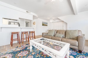 Main living spaces looking toward front entry. Open floor plan between living, kitchen and dining areas.
                