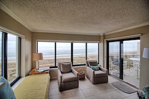 Living room views are panoramic.  Swivel chairs are great for viewing the beach.