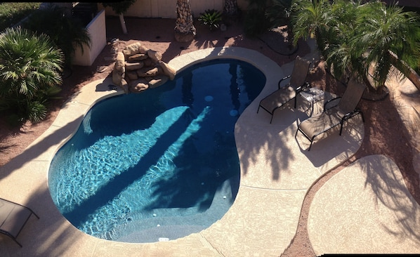 Beautiful pool in a tropical setting.