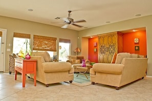 Living room area in Great Room overlooks pool