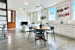 Dining Area/Kitchen looking into Living Area and Front Entrance