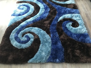 Very soft sea wave area rug on whitewashed floors. Fashion-forward & fun!