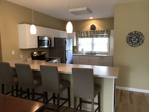 Fully equipped modern kitchen with large breakfast bar