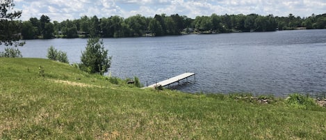 View from patio. Small swimming area to the left of dock. 