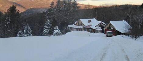 View of the house, garage and Green Mountains beyond in winter