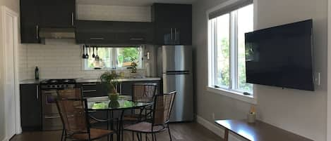 Kitchen and Dining Area. Stock the fridge from the neighborhood grocery!