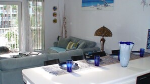 Breakfast bar with seating for four open to living room and kitchen.