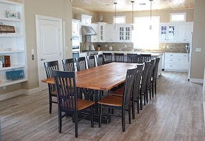 Dining area and kitchen fully equipped with high end appliances and cookware.