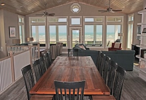 Third floor living and dining area with panoramic view of beach and ocean.