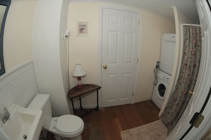 First floor bathroom with shower and washer/dryer.