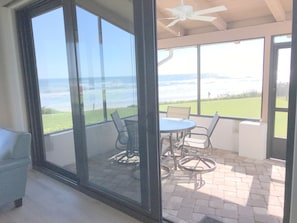 New sliding doors open to screened porch