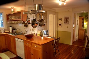 Beyond the main part of the kitchen is a computer area.