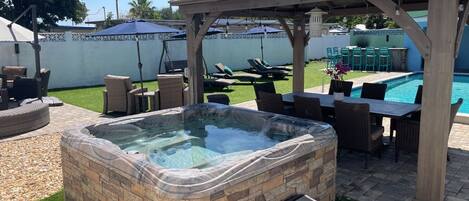 1st hot tub, dining area, pool, artificial turf, seating and space for 30! 