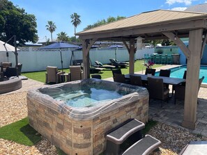 1st hot tub, dining area, pool, artificial turf, seating and space for 30! 