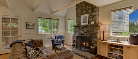 Classic rock fireplace, plenty of windows and high ceiling in the great room.