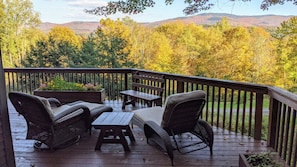 Startyour leaf peeping right from these comfortable lounge chairs on the deck