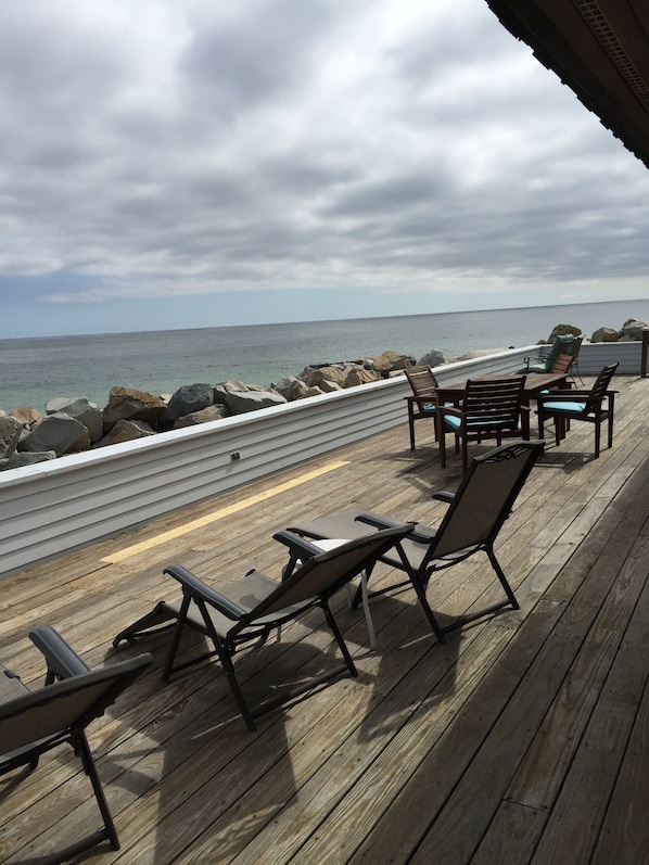 Large front deck runs full length of the house and has plenty of tables & chairs