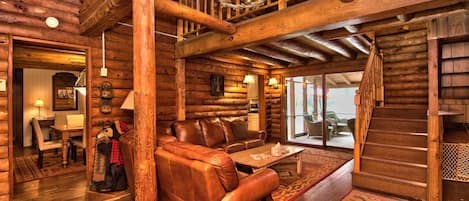 Rustic Log Cabin Entrance -- cozy up to the wood burning fireplace.