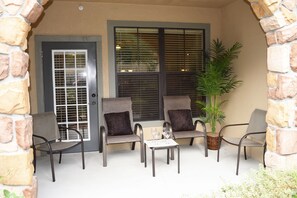 Attractive patio with a stone archway and seating