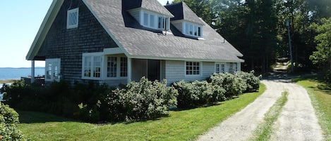 View of house as you arrive (restored kitchen porch and door can be seen)