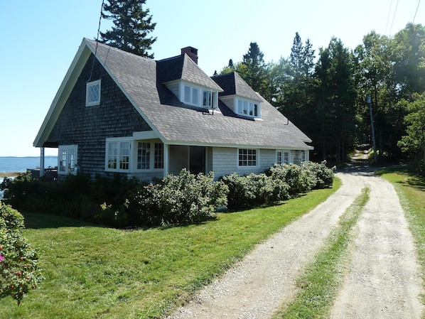 View of house as you arrive (restored kitchen porch and door can be seen)