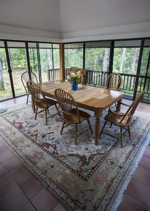 Screened in dining area- table opens to seat 12.