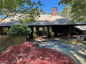 Enter an architectural gem surrounded by gardens and woods.