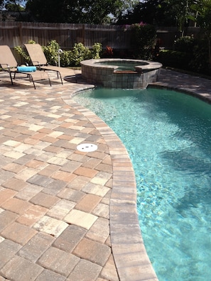 Lounge by the tranquil pool.