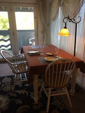 The dining table seats up to four.