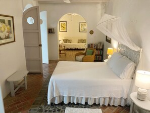 Typical colonial architecture, an arch divides the bedroom and the living room