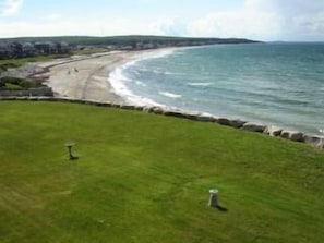 Manicured Lawn with beach below at high tide ... 