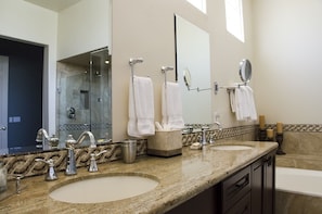 Dual sinks and granite countertop in the Primary Bath