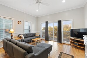 Living space that leads to large screened-in porch