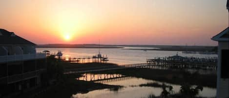 Watch Spectacular Sunsets from the master balcony or the dock at Waters Edge