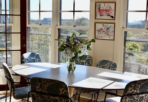 Dining room with Saarinen oval table, conducive to lingering over family meals