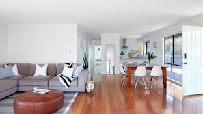 living and dining rooms with a view into the kitchen