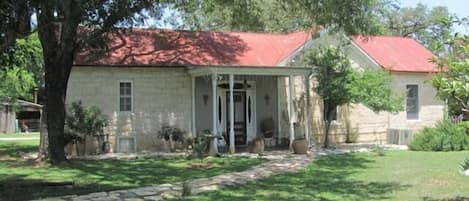 Artist owned, charming early Fredericksburg limestone home