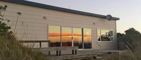 Sun setting on the beach house